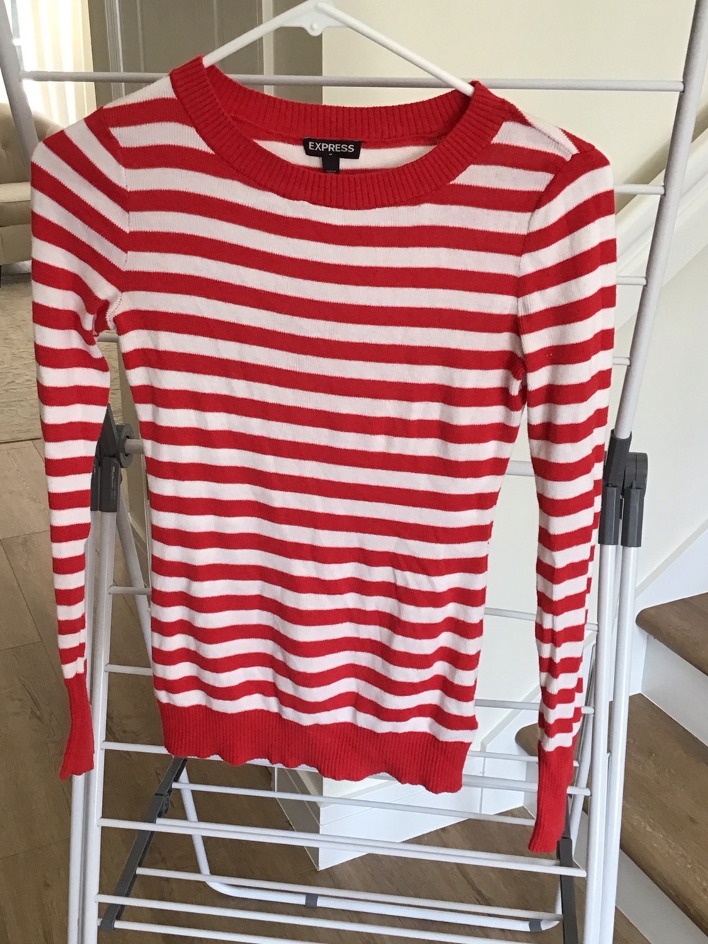 Express striped crew neck sweater features a red and white striped